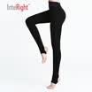 A woman wearing a black pants