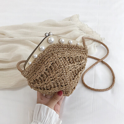 Small bag female new fashion wild pearl dumplings wrapped hemp rope hollow woven shoulder Messenger bag
Small bag female new fashion wild pearl dumplings wrapped hemp rope hollow woven shoulder Messenger bag