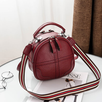 A girl with a double shoulder bag a broadband shoulder bag a Korean version of a backpack a girl slanted a small round bag and
A girl with a double shoulder bag a broadband shoulder bag a Korean version of a backpack a girl slanted a small round bag and