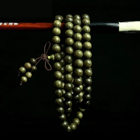 Qiaopin Sichuan golden nanmu gloomy wood Buddha beads bracelet for men and women 108 nanmu jewelry Wenwan agarwood grade ebony gloomy golden nan 10mm*108 pieces Qiaopin Sichuan golden nanmu gloomy wood Buddha beads bracelet for men and women 108 nanmu jewelry Wenwan agarwood grade ebony gloomy golden nan 10mm*108 pieces