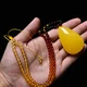 Auchini Beeswax Pendant Amber Chicken Oil Yellow Full Honey Water Drop Pendant 3-5g Men and Women Models M080106001 Auchini Beeswax Pendant Amber Chicken Oil Yellow Full Honey Water Drop Pendant 3-5g Men and Women Models M080106001