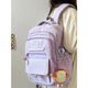匡睿 書(shū)包初中生女大容量高中大學(xué)生雙肩包高顏值小學(xué)生3-6年級背包 紫色（帶面包片掛件+1枚小吊墜）