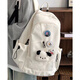 鑫沐（XINMU）日系大容量書(shū)包女ins簡(jiǎn)約百搭純色大學(xué)生電腦背包初中生雙肩包女 白色【隨機3枚徽章+小狗頭掛件】
