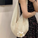 依儷烏編織包包女2025新款韓版單肩 托特包慵懶風(fēng)針織鏤空花朵沙灘包 米白色小花包