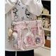 睿昂日系透明吧唧漫展痛包日常娃包單肩包女學(xué)生上課通勤托特包斜挎包 粉色 帶蝴蝶結+長(cháng)腿餅干掛件