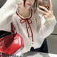 歌詩(shī)慧新年韓系針織衫開(kāi)衫女2025秋季新款女裝秋裝蝴蝶結短款毛衣上衣 紅色蝴蝶結白色針織衫 均碼