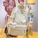 卡特駱蝴蝶結刺繡小清新書(shū)包女初中生高顏值ins大容量背包高中生雙肩包 白色【帶飛行兔掛件】