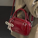 逸兼酒紅色小包包女2026春夏新款手提枕頭包百搭質(zhì)感復古斜挎包 紅色（帶掛飾）