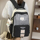 鑫沐（XINMU）小清新格子書(shū)包女初中生高顏值高中生大容量雙肩包小學(xué)生百搭背包 黑色【干飯熊掛件】