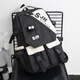 小憨象2024新款雙肩包女初中生高中大學(xué)生書(shū)包男小眾小學(xué)生三到六年級潮 黑白色【扭扭節+黑眼睛徽章】