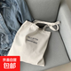 帆布包休閑男女學(xué)生大容量手提包ins風(fēng)簡(jiǎn)約字母逛街小眾單肩包包 白色 均碼