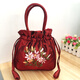 帝行新款民族風(fēng)復古繡花布包水桶包抽繩手機包收納包工藝手工女包 酒紅色
