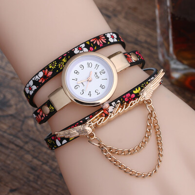 

New broken pattern ladies winding fine strap watch female models fashion wings pendant quartz watch