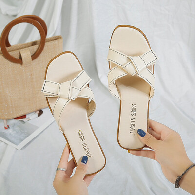 

2019 New summer net red casual beach one-word cold slippers womens flat out of fashion out of fashion
