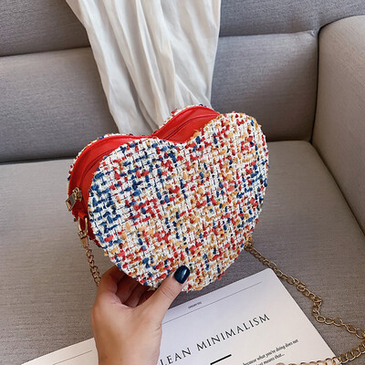 

Sen temperament chain Messenger bag fashion wild personality heart-shaped bag female 2019 new simple contrast color woven bag