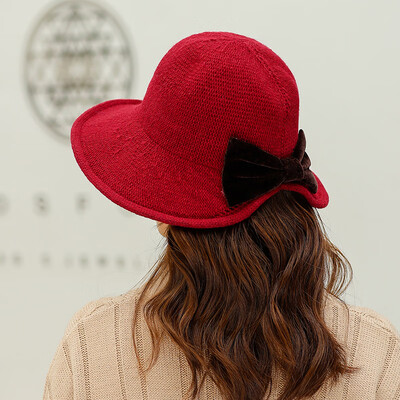 

Autumn&winter new 100 sets of warm knitted wool cap Wool ladies Korean version after opening bow bow pure color pot cap