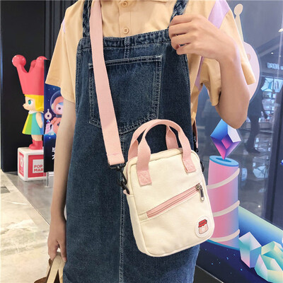 

On the new small bag canvas bag woman single shoulder bag oblique satchel college students hit the color of the ancient girl ins s