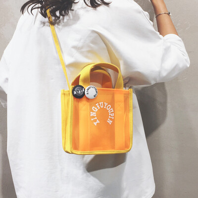 

Portable transparent bag canvas bag handbags new 2019 students Korean version of the slung Japanese girls cute shoulder bag tide