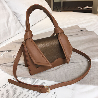 

Qiao Bani 2019 new European&American style fashion magazine with the same paragraph color PU flip bag hand strap shoulder diagonal female bag