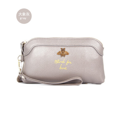 

The first layer of cowhide 2019 new ladies leather Europe&America bee bills position shell type clutch bag long wallet