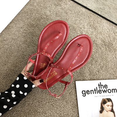 

Summer Roman Pin-toed Rivet Flat-soled Sandals Lady with Baitao Beach Fairy Wind Sandals