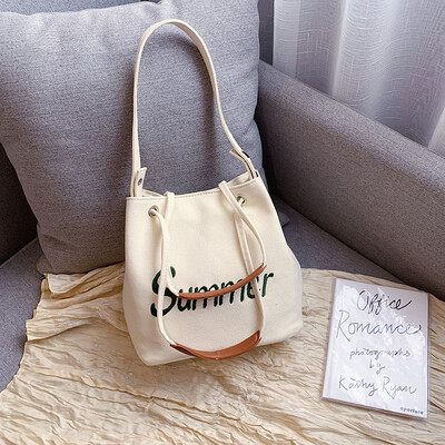 

Summer new casual bag female 2019 new Korean fashion letters canvas bag wild single shoulder slung bucket bag