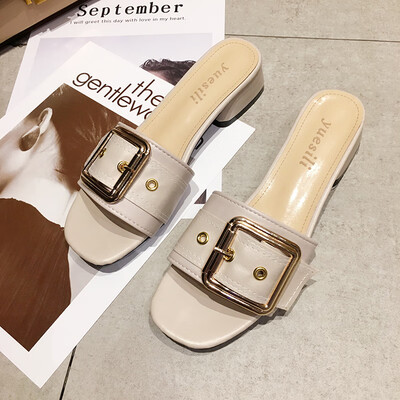 

She wears beach slippers outside the summer