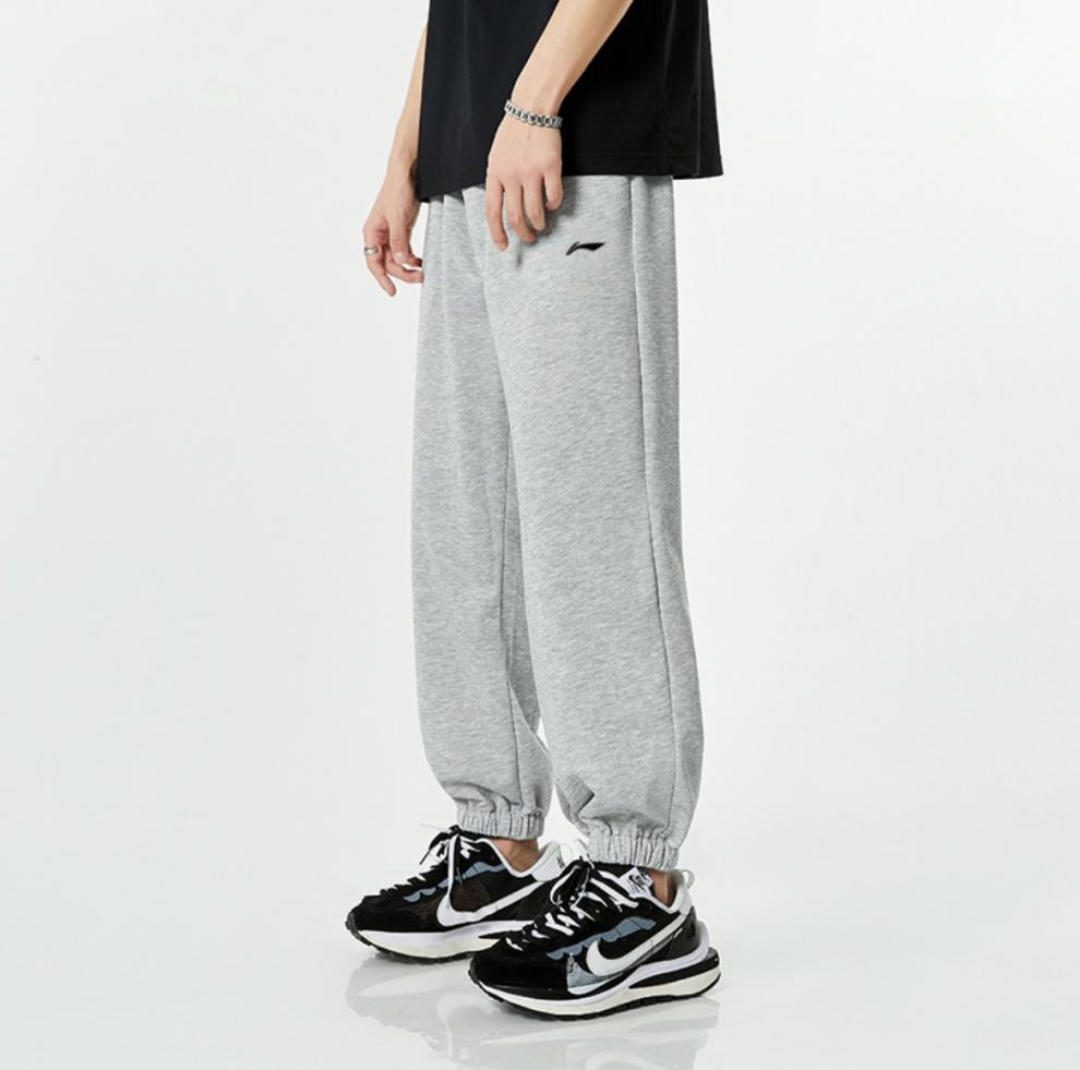 李宁卫裤男士新款足球系列男子收口束脚时尚休闲运动长裤aklr561刚花