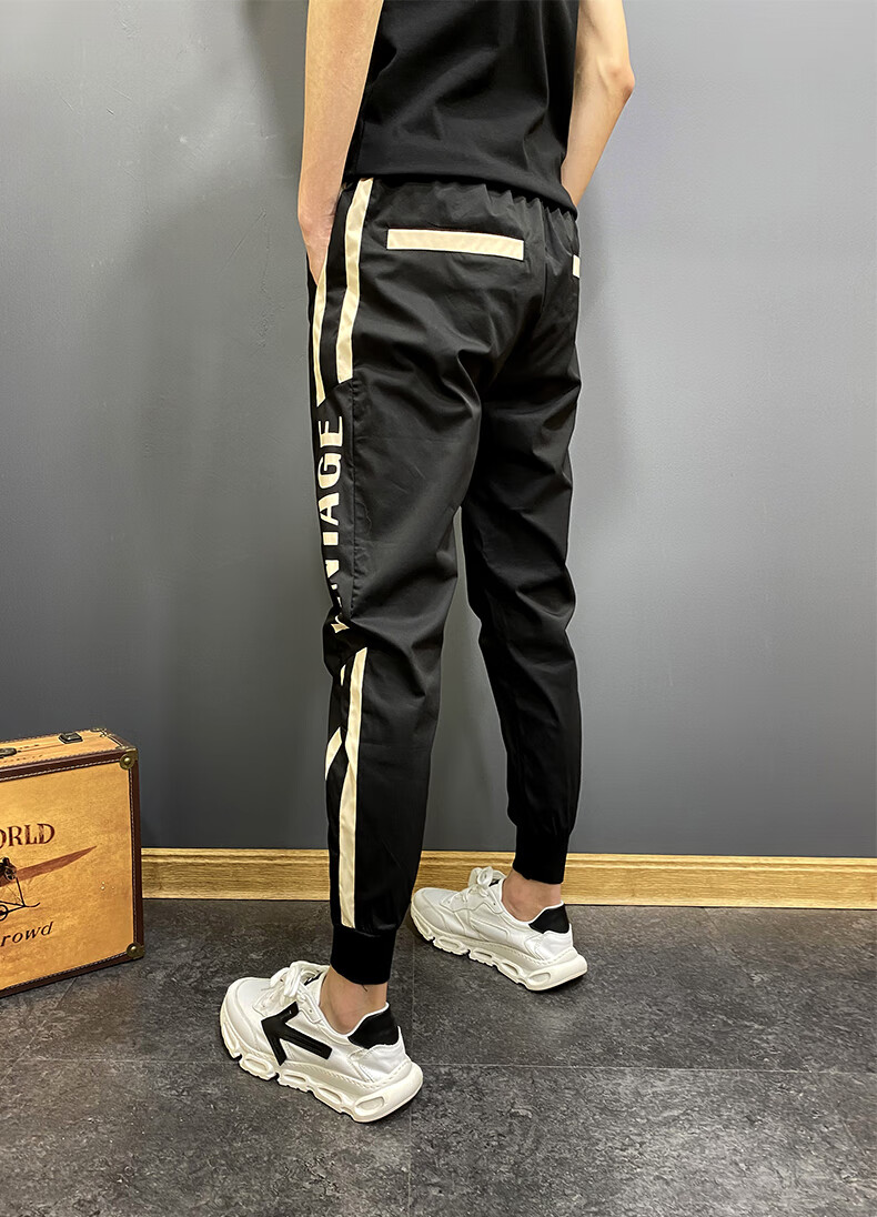 精神小伙裤子夏秋季网红帅气小伙九分哈伦束脚裤修身双杠大码休闲