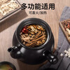 Sister-in-law Jin decoctions the medicine in a casserole and boils the Chinese medicine jar. Open fire ceramic medicine pot. The Chinese medicine pot boils the medicine in the casserole.