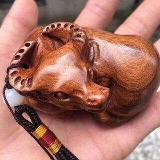 Huanghuali wood carving handle pieces for the year of the ox and ox luck handmade solid wood carvings for playing with the twelve zodiac signs huanghuali lying ox 7 cm * 4 cm