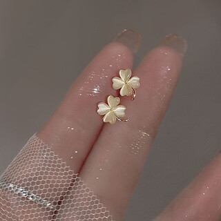 Ykincasl old phoenix 9999 sterling silver four-leaf clover temperament earrings for women cat's eye stone women's 2025 new earrings earrings cat's eye four-leaf clover earrings silver needle lao fengxiang's same style