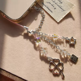 The shopkeeper's four-leaf clover mobile phone dust-proof plug tassel pendant apple android type-c charging port dust-proof and waterproof mobile phone accessories type-c/elliptical interface-four-leaf clover tassel pendant