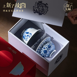 There is a new cultural and creative forbidden city blue and white hand-pressed kung fu tea cup set gift box. the master cup is a mid-autumn festival birthday gift for the elders.