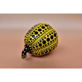 Yayoi kusama pumpkin ornament sculpture with dense polka dots, yellow background and black dots 10x12 without label
