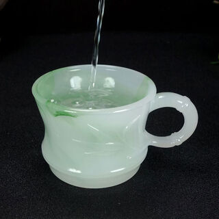 The jade cat purifies the water quality, pure jade tea cups, coffee cups, beer cups, breakfast cups, health and high-end tea sets, as shown in the picture, purifying the water quality and improving the jade cup.