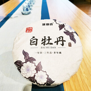 Ruijincheng fujian high mountain white tea white tea cake head dried floral scented pressed tea 300g tea manufacturer wholesale 300g single cake package