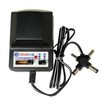 500ma adjustable voltage dc power adapter 3v 4.5v 6v 7.5v 9v 12 volt multi-purpose transformer. the output is a cross-type interface with 4 types of plugs.
