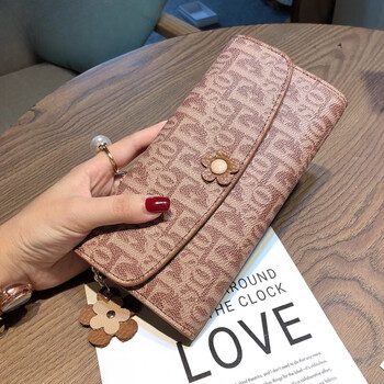 Woodpecker (tucano) spring new fashion long large capacity hand wallet women's attractive 2024 new style with genuine leather money brown