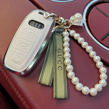 Digalen is suitable for 25 audi a3 a6l a7 a8 q5l a4l all-inclusive genuine leather key bag protective cover for women, white cover + green ribbon buckle