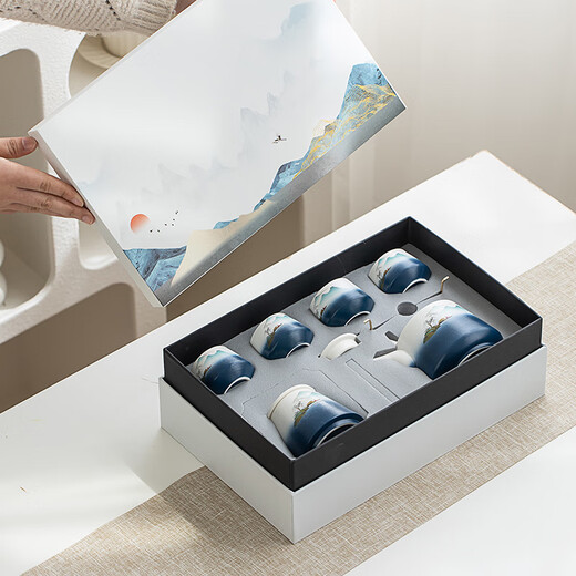 Gold inlaid jade Kung Fu tea set, a complete set of ceramic lifting kettles, tea cups, tea cans, Kung Fu tea sets, souvenirs, scenic blue and white lifting sets