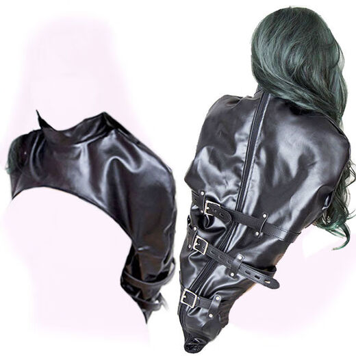 Alternative flirting fun, hands behind the back, arms together, whole body wrapped in leather, restraints and training, shoulders covered, arms restrained, strong belts