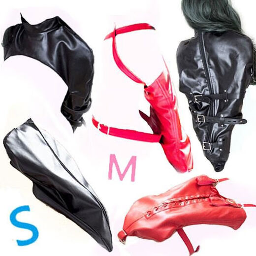 Alternative flirting fun, hands behind the back, arms together, whole body wrapped in leather, restraints and training, shoulders covered, arms restrained, strong belts