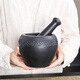Natural black gold stone hand-carved old-fashioned stone mortar, garlic mortar, stone cup, garlic pounder, medicine jar, nest pounding bowl, pounder, black stone stone mortar outer diameter 13, carved vine flower