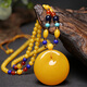 Fat Donglai's same style beeswax water drop pendant old chicken oil yellow necklace accompanying men and women amber gold chicken oil yellow peace buckle pendant
