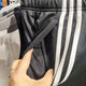 
Adidas official website official men's pants spring hoodies sports trousers fitness training pants men's fashion versatile classic pants EI9761/three stripes/open pants 2XL (185)