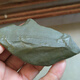 Xinjiang Hami surface green clay jade raw stone hand piece 100 grams, complete appearance and exquisite winding line