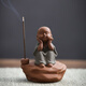 The ancient Zen-like purple sand can raise tea pets, the little monk's tea room decorations, the tea table, the little novice monk's incense, the aromatherapy incense burner decorations, the little purple sand monk gives a short-string incense.