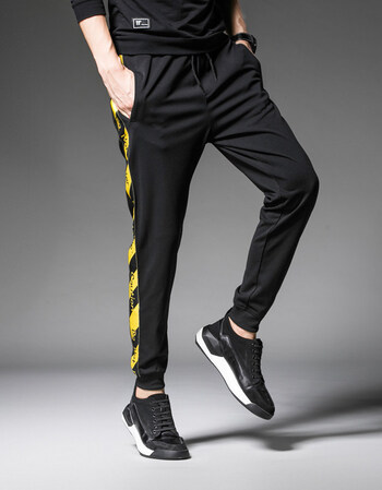 男秋季宽松黑色休闲裤子条纹韩版小脚运动裤港风学生哈伦裤 黄色 l