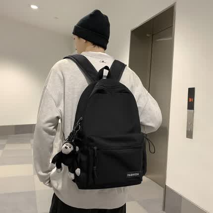 匡顿书包男双肩包女背包大容量新款韩版初高中大学生潮流百搭日常出行休闲耐磨防泼水可放15.6英寸笔记本 黑色（带猩猩挂件）